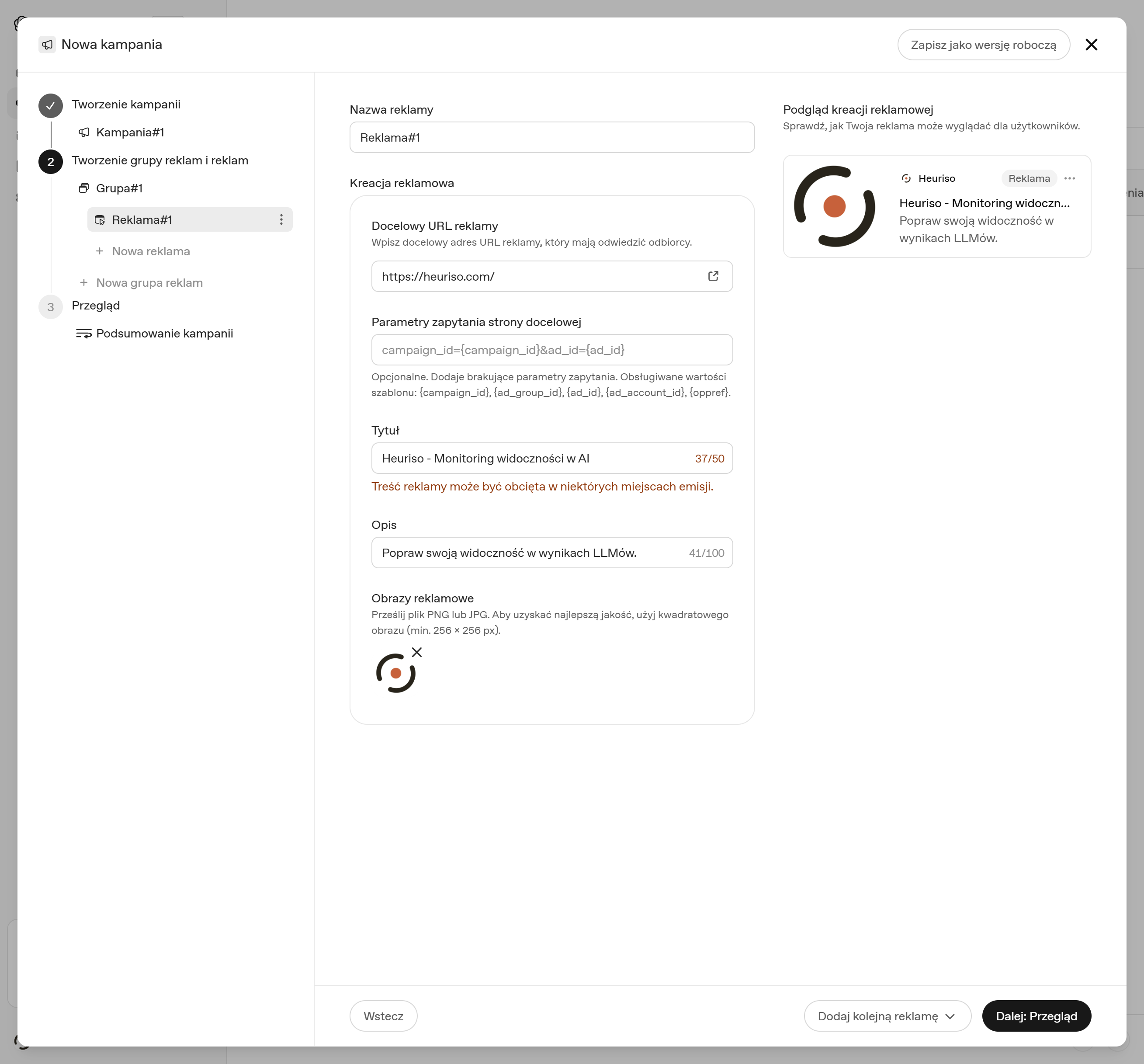 Formularz tworzenia reklamy ChatGPT Ads z adresem heuriso.com, tytułem, opisem, przesłaną grafiką i podglądem karty reklamowej Heuriso